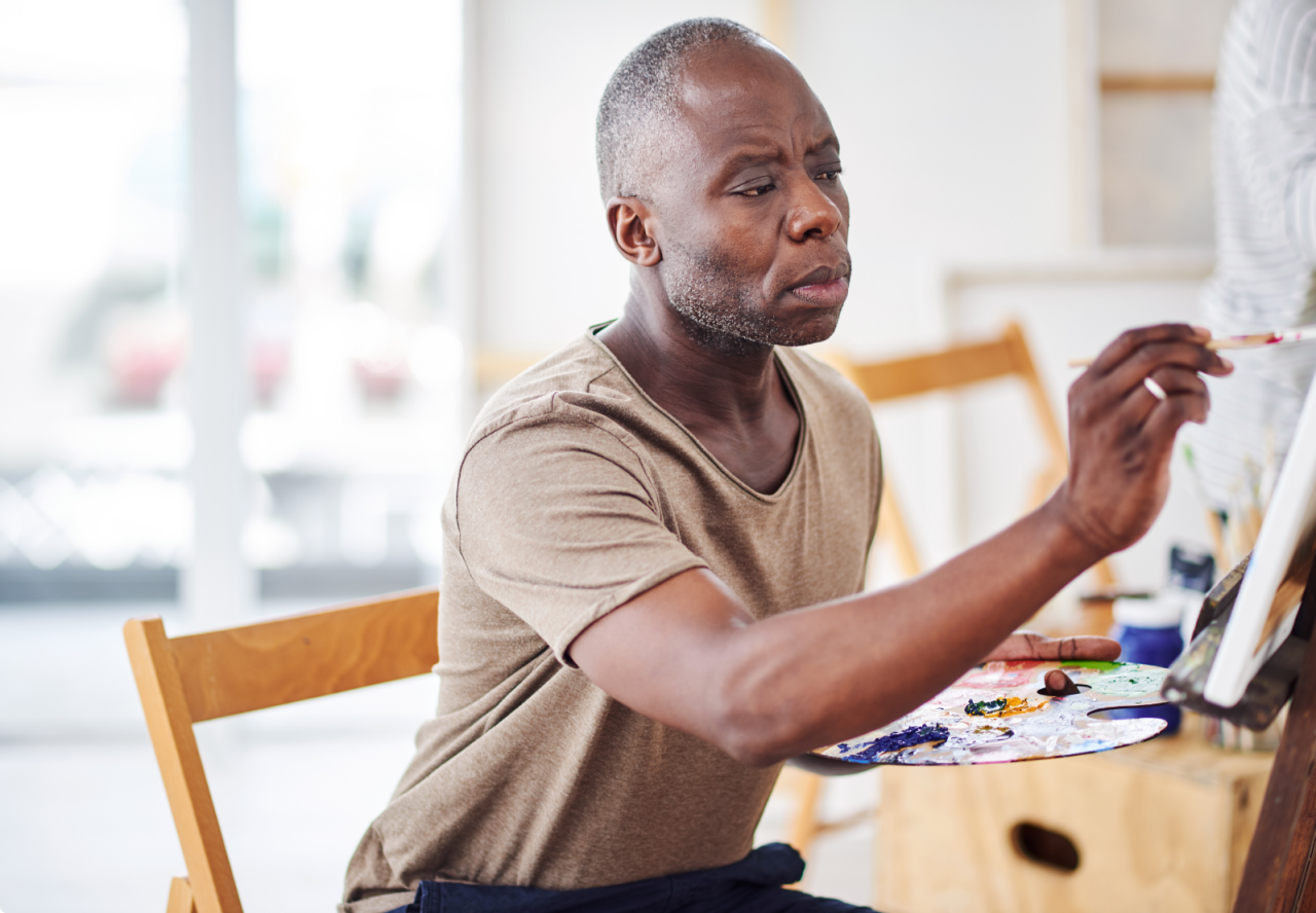 Older woman in a chair having a conversation.