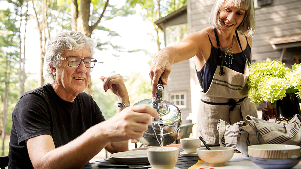 Mother and daughter making dumplings together.