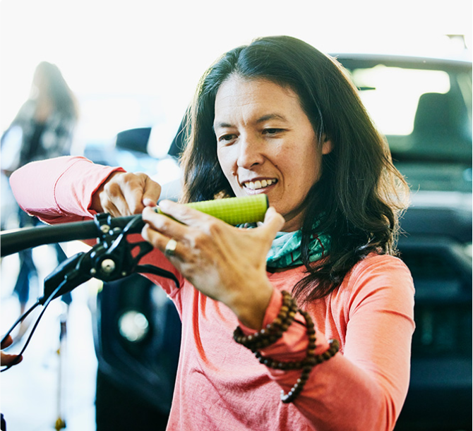 Woman fixing a bike